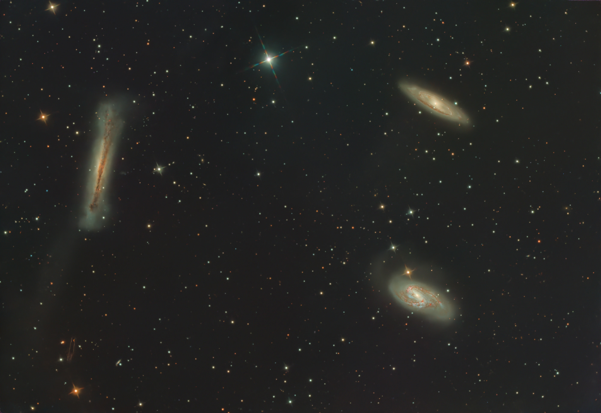 The Leo Triplet (also known as the M66 Group) is a small group of galaxies about 35 million light-years away in the constellation Leo. This galaxy group consists of the spiral galaxies M65, M66, and NGC 3628.